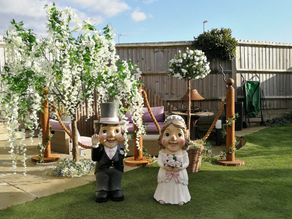 Wedding decorations including rope barriers and trees